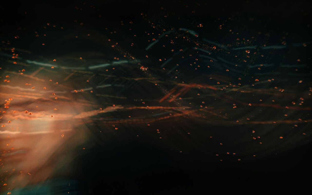 A soft blur of orange and blue light